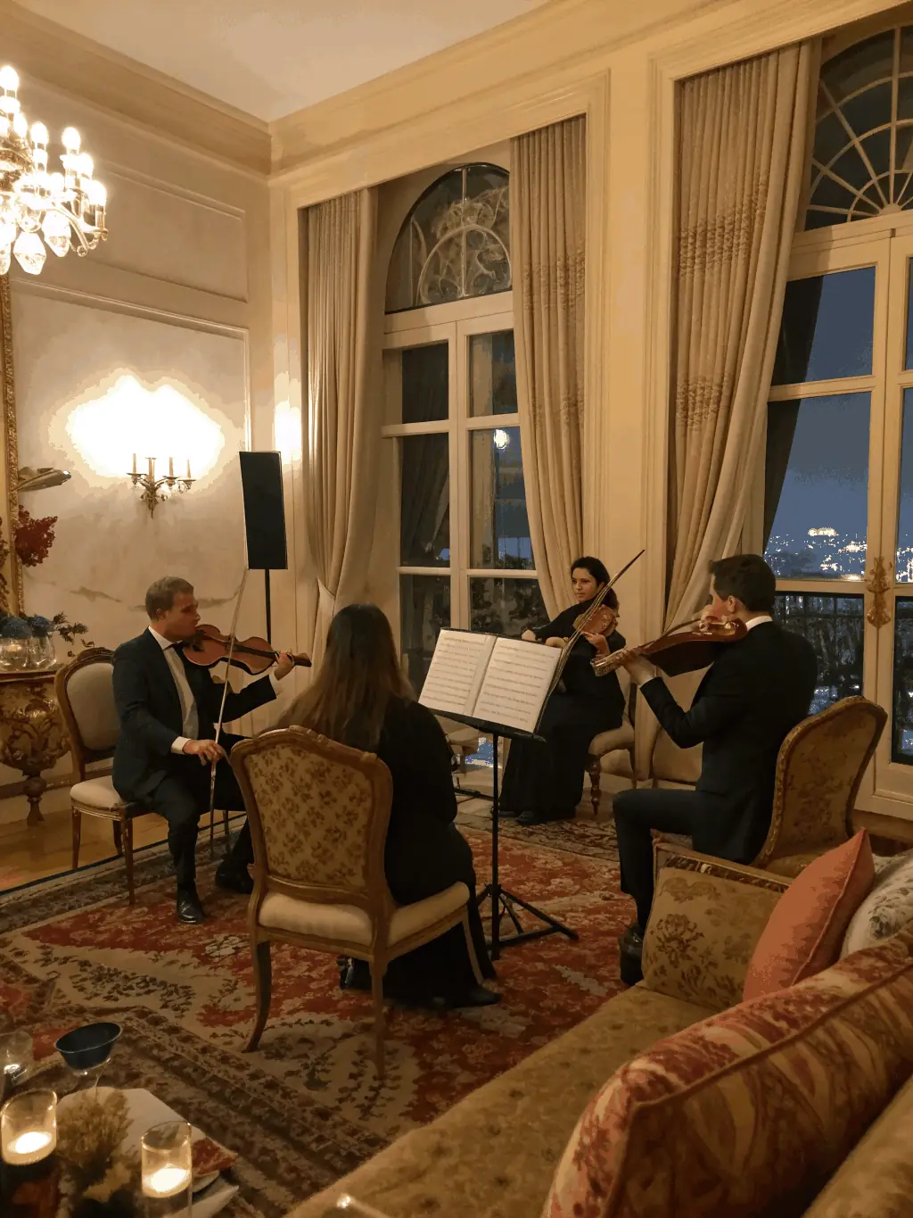 A photo of a string quartet rehearsing in a historic building, emphasizing the association's dedication to preserving and promoting cultural heritage.